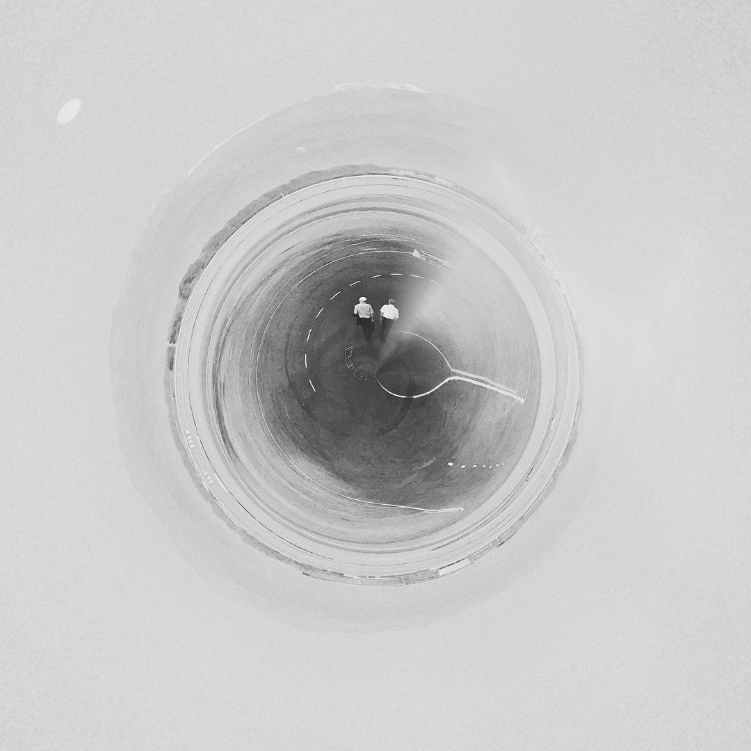 Circular ice tunnel with two people