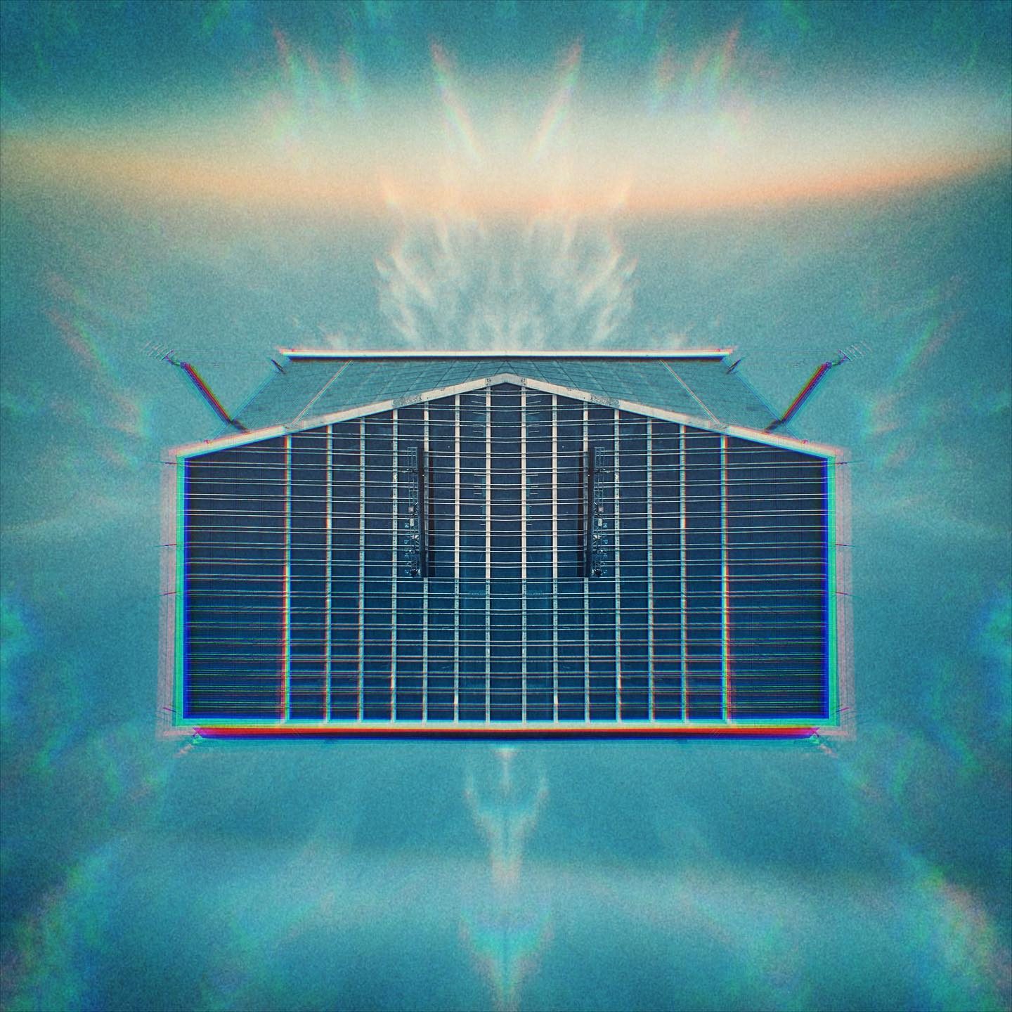 Solar panel-covered building against blue sky