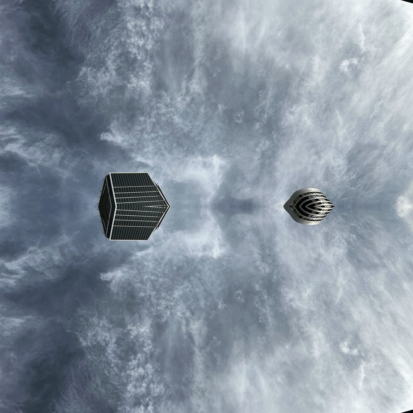 floating geometric shapes in cloudy sky