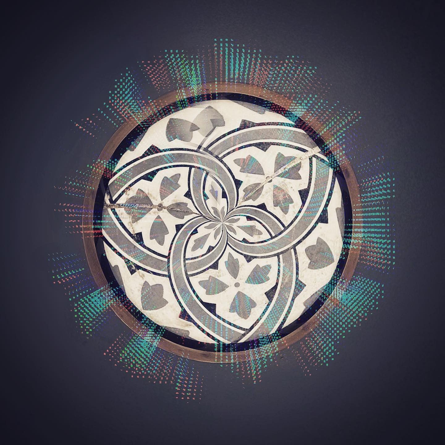 Abstract circular design with interlocking rings and floral motifs